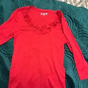 Red long sleeve top with embellishment around neck size small